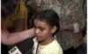 Menina emociona ao falar sobre morte da mãe durante entrevista na festa de Nossa Senhora do Carmo
